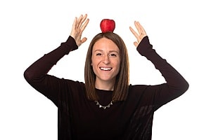 Chelsea Davis of Orases with an apple on her head