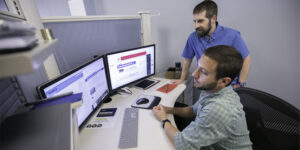 orases employees working together on a task