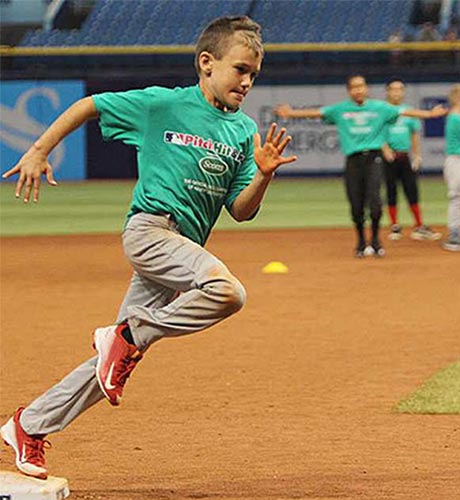 Kid running bases