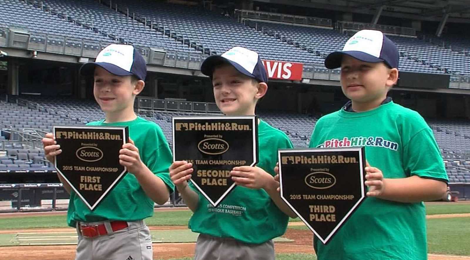 Kids holding MLB plaques