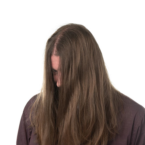 daniel petway team member at orases hiding behind his hair