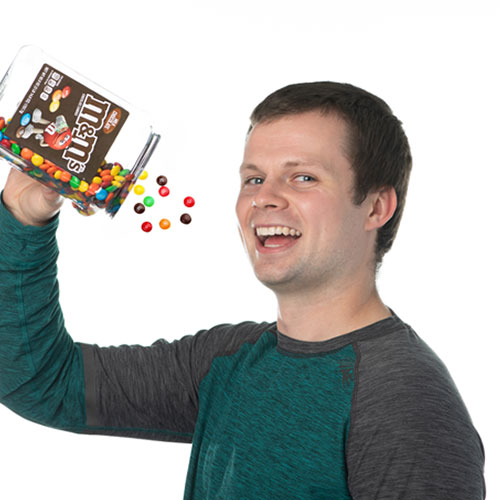 kevin boyd team member at orases eating chocolate candies