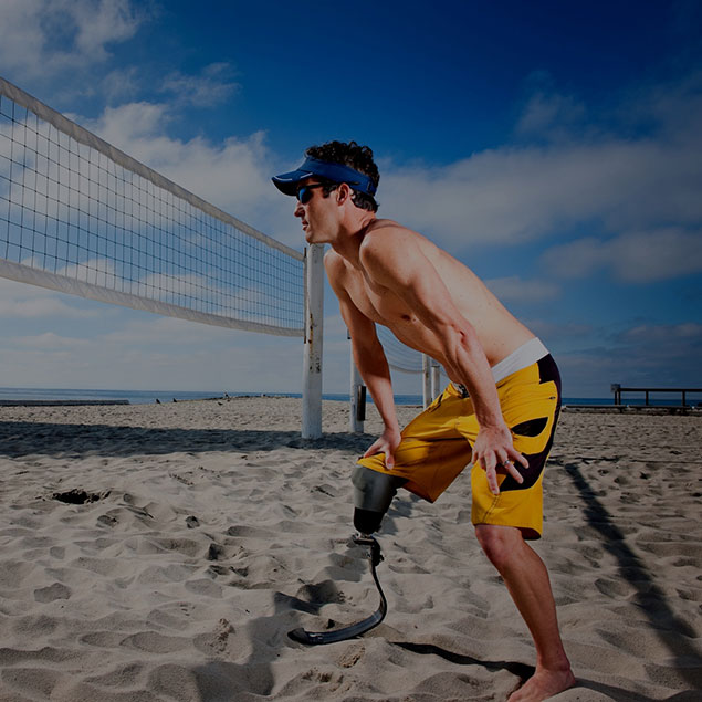 orthocare solutions patient at the beach playing volleyball