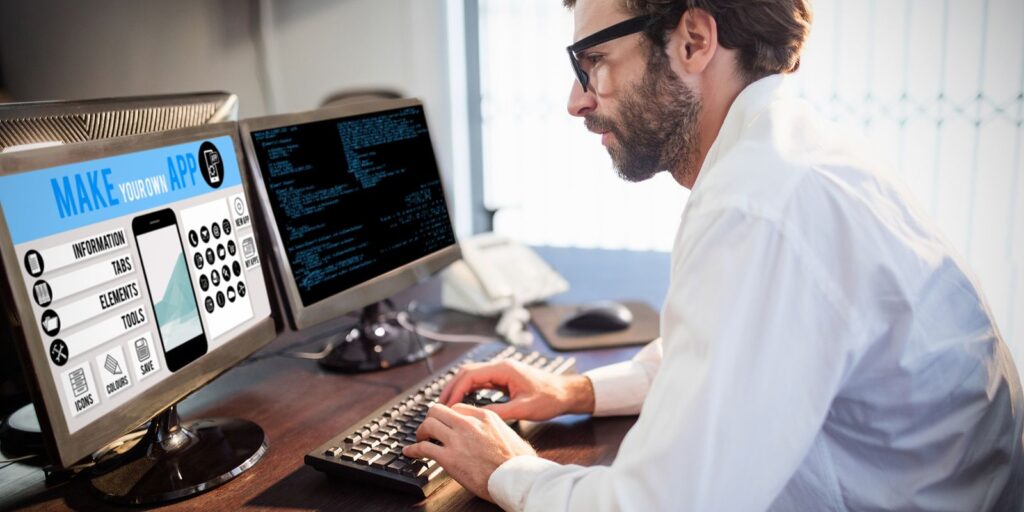 A programmer working on a software.Two main types of software used for business processes are custom software and SaaS
