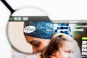 Magnifying glass over Pfizer website