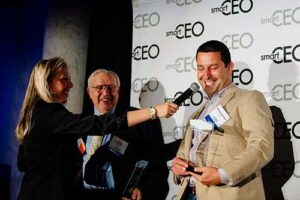 Nick receiving award from Baltimore SmartCEO Magazine
