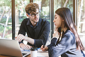 employees discussing different types of database migrations