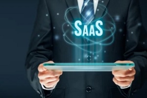 man holding tablet with saas concept