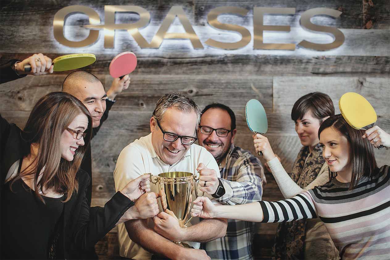 banner-orases-employees-posing-with-trophy