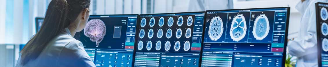 Doctor looking at brain scans shown through custom medical imaging software