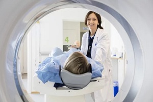 radiologist putting patient in the machine