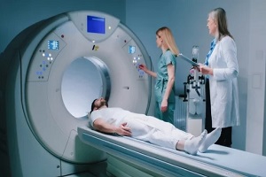 young man lies down in MRI capsule