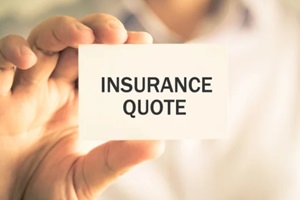 businessman holding insurance quote message card
