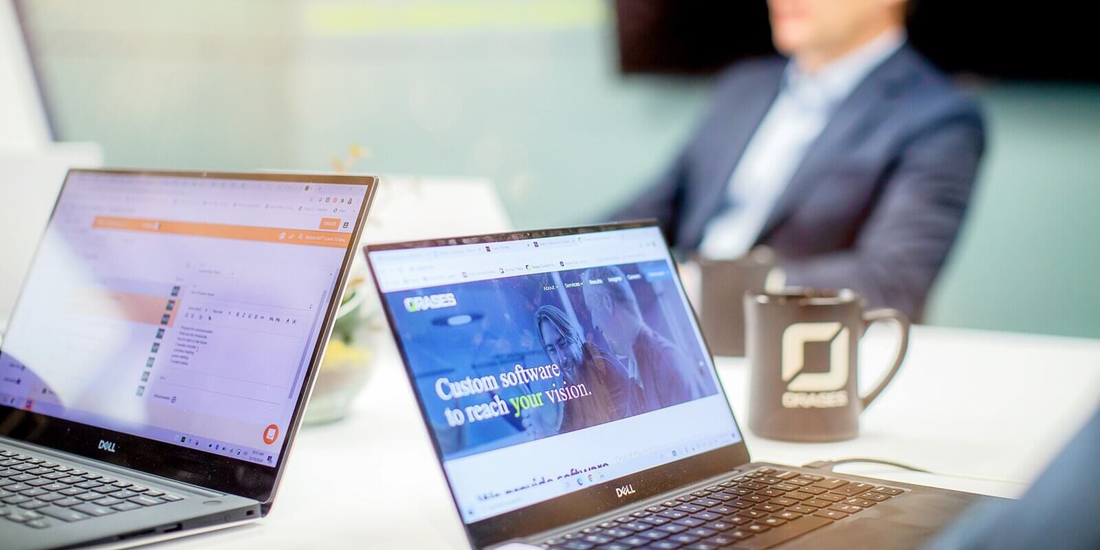 focus on two laptops during a team meeting