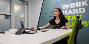 female orases employee working on a laptop