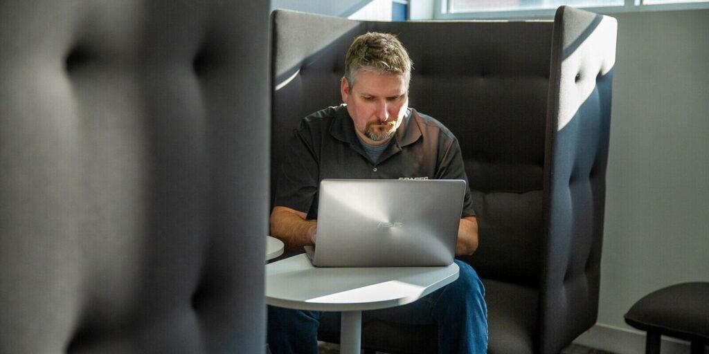 dedicated employee working on a laptop