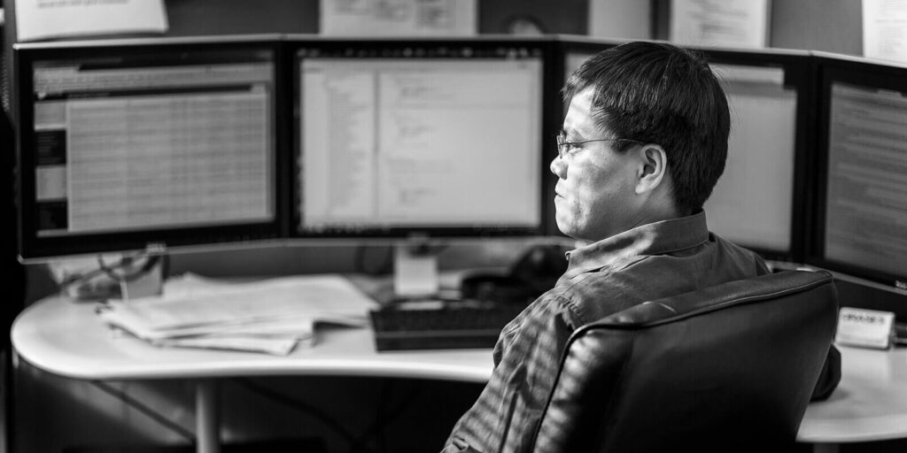 male employee sitting near desk