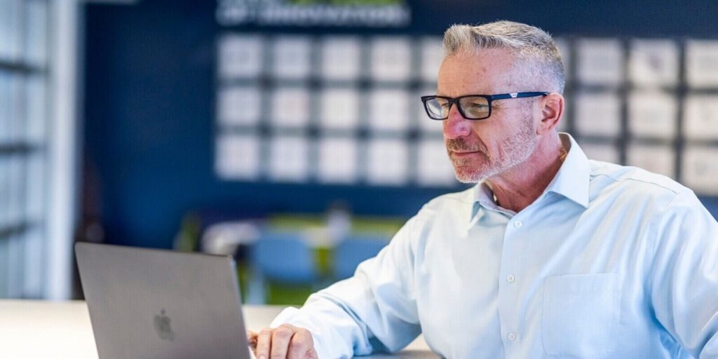 aged employees working on a laptop
