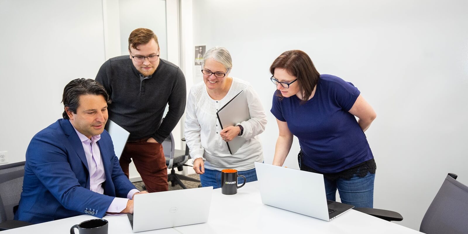 diverse team engaged in a productive discussion, sharing ideas and reviewing strategies together in a modern office setting